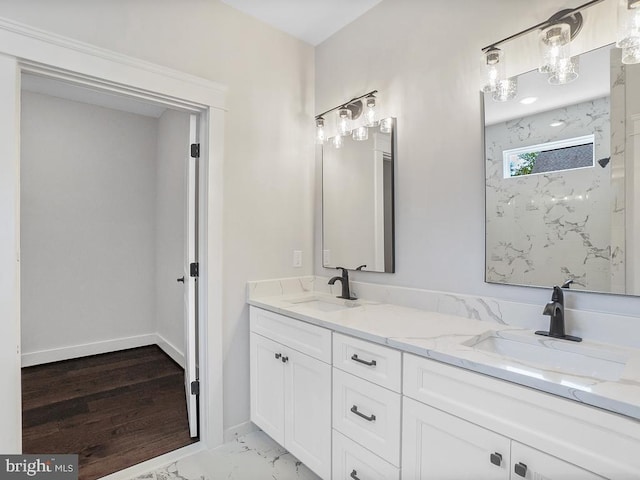 bathroom with walk in shower and vanity