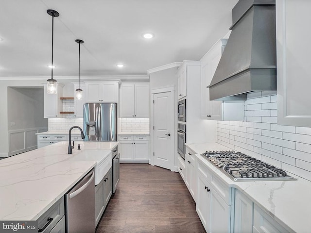 kitchen with premium range hood, white cabinets, and stainless steel appliances