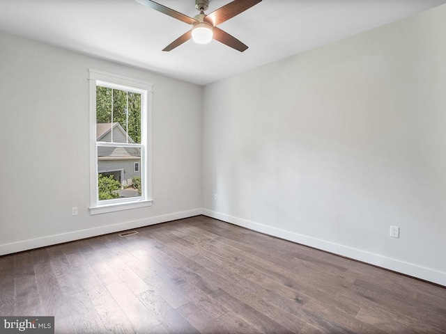 spare room with ceiling fan and wood-type flooring