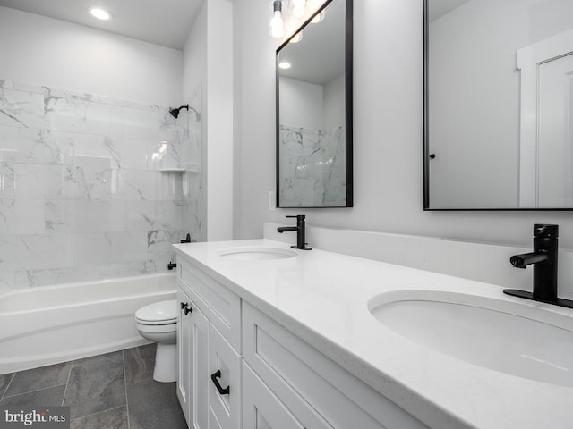 full bathroom with toilet, tiled shower / bath combo, tile patterned floors, and vanity