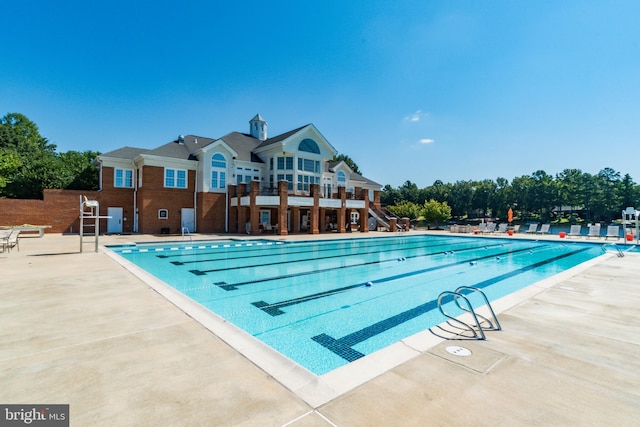 view of swimming pool featuring a patio area