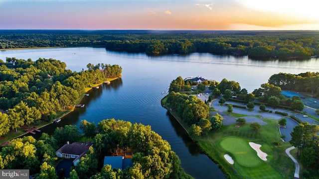 aerial view at dusk with a water view