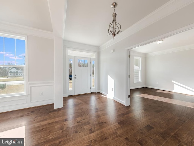 entryway featuring plenty of natural light, dark hardwood / wood-style flooring, and crown molding