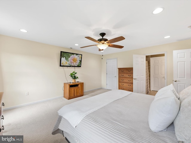 bedroom with light carpet and ceiling fan