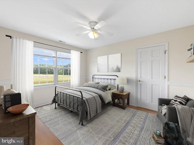 bedroom featuring ceiling fan and hardwood / wood-style flooring