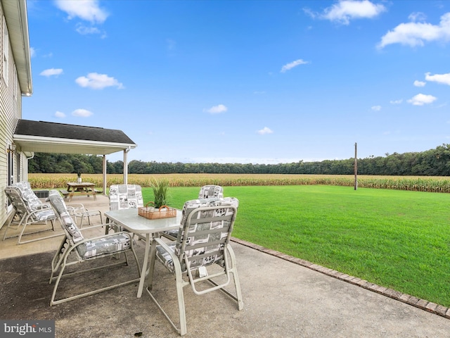 view of patio / terrace with a rural view