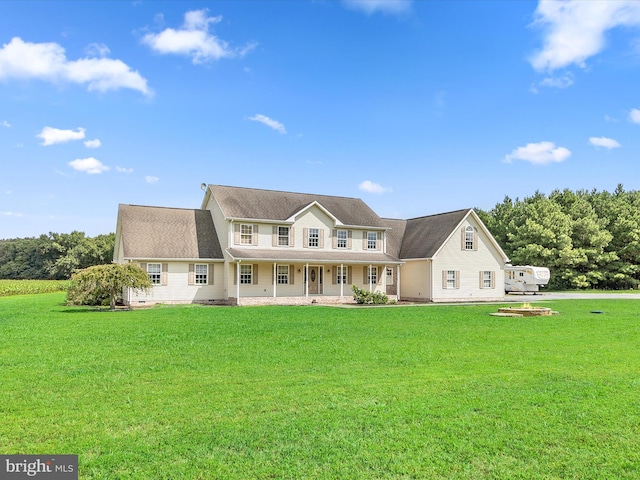 view of front of house with a porch and a front yard