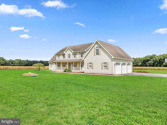 view of front facade with covered porch, a front lawn, and a garage