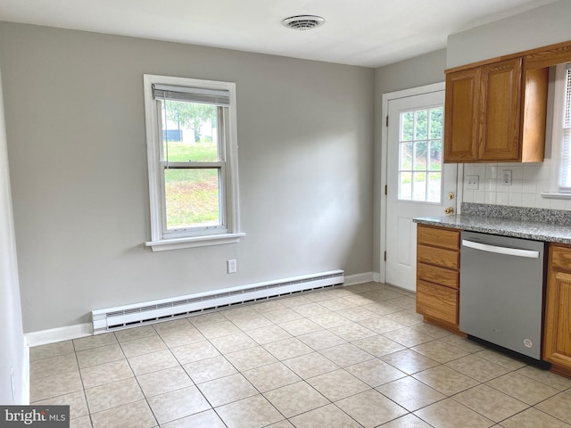 kitchen featuring light tile patterned floors, a baseboard heating unit, stainless steel dishwasher, and tasteful backsplash