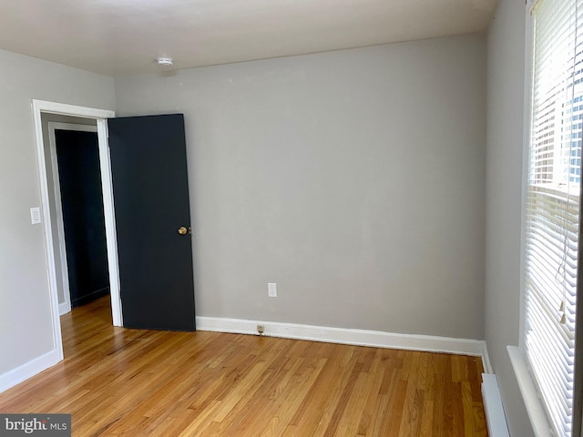 spare room featuring light hardwood / wood-style floors