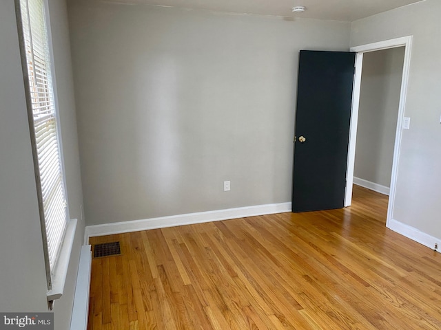 unfurnished room featuring light wood-type flooring