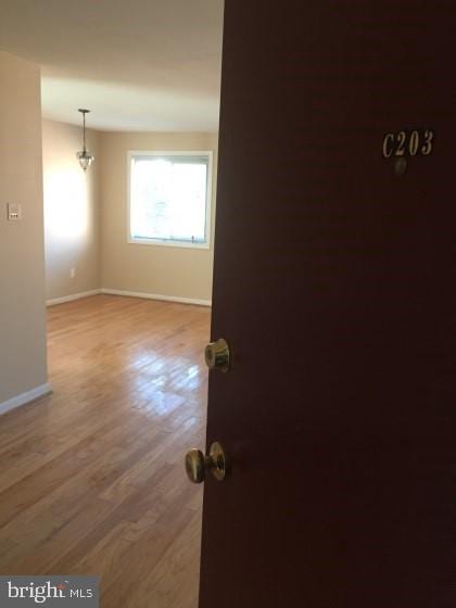 empty room featuring hardwood / wood-style flooring