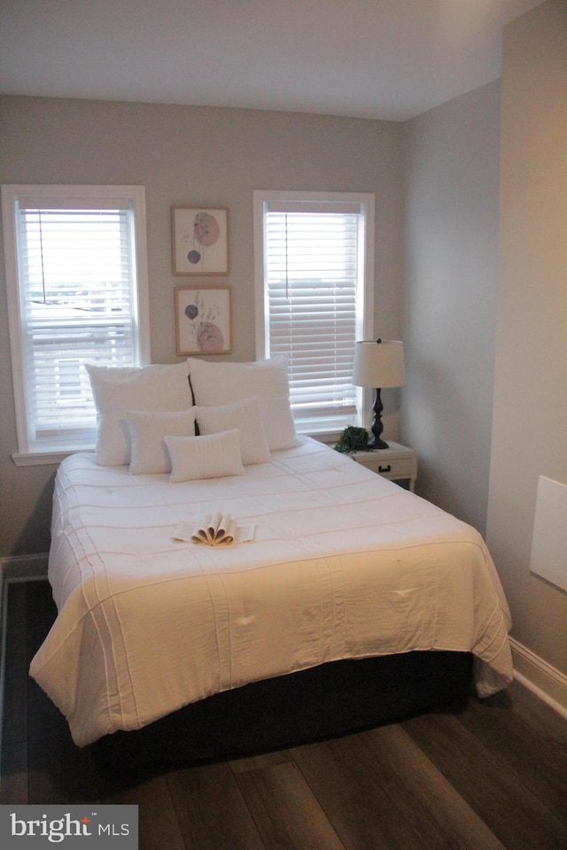 bedroom featuring dark hardwood / wood-style flooring