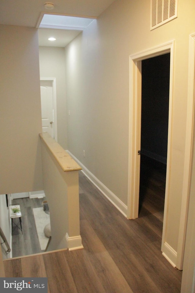 hallway with dark wood-type flooring