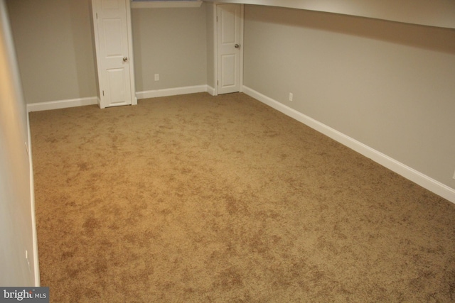 basement with light colored carpet