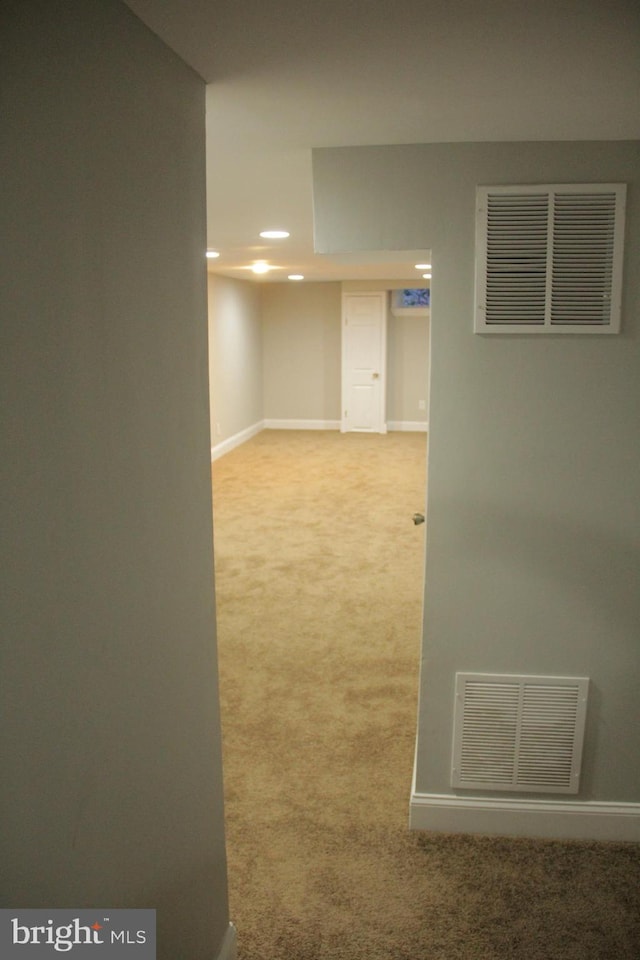 interior space featuring light colored carpet