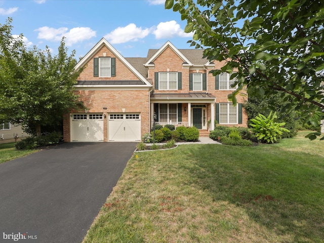 craftsman inspired home featuring a garage, a front yard, and covered porch