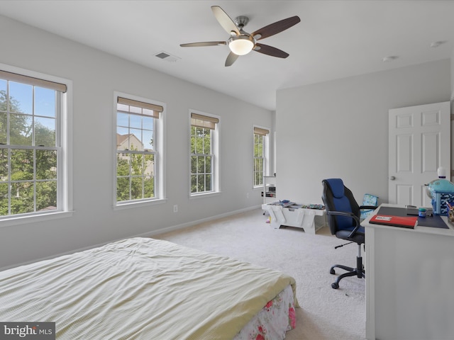 carpeted bedroom with ceiling fan