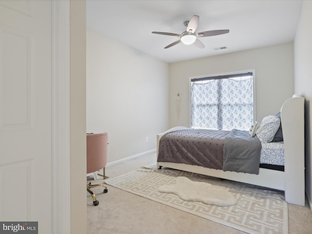 carpeted bedroom featuring ceiling fan