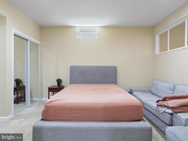 carpeted bedroom with a closet