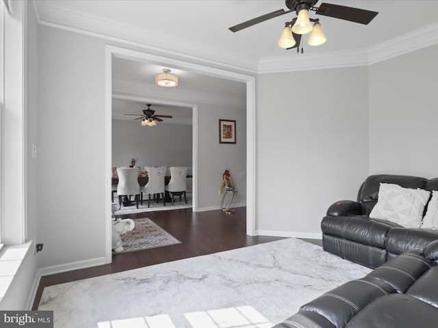 living room with crown molding and dark wood-type flooring