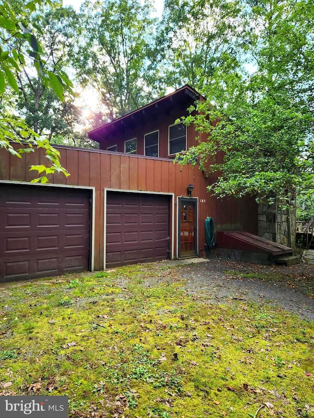 exterior space with a garage