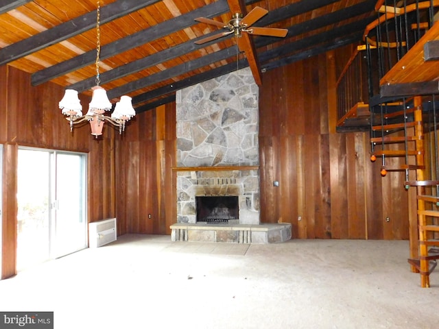 unfurnished living room with a fireplace, ceiling fan with notable chandelier, lofted ceiling with beams, and wooden ceiling