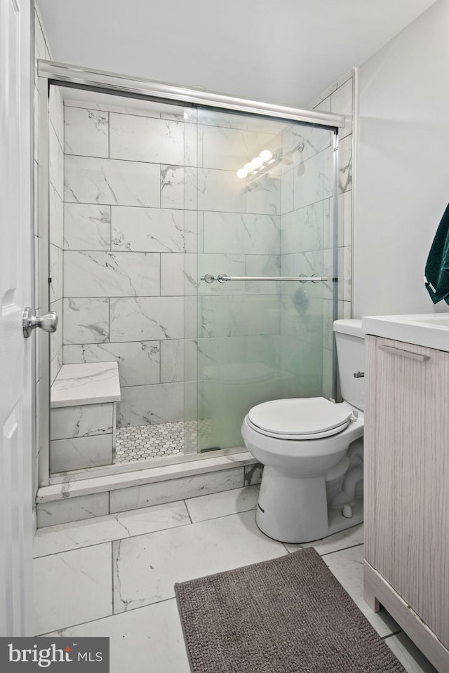 bathroom featuring toilet and walk in shower