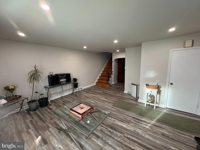 unfurnished living room with wood-type flooring