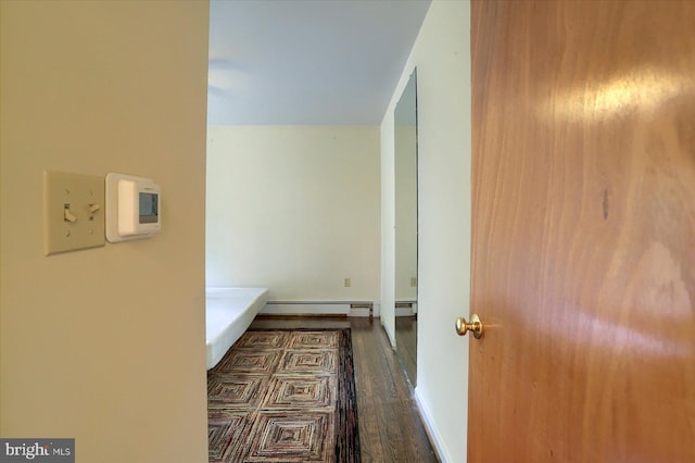 corridor featuring dark wood-type flooring