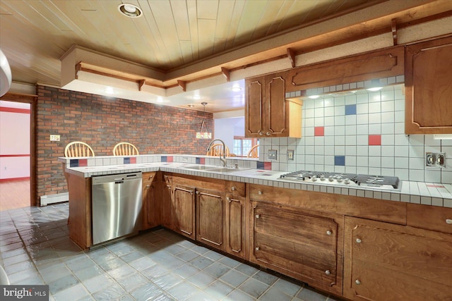 kitchen with tasteful backsplash, kitchen peninsula, wood ceiling, appliances with stainless steel finishes, and tile countertops