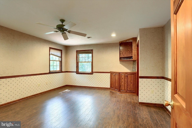 spare room with ceiling fan and hardwood / wood-style floors