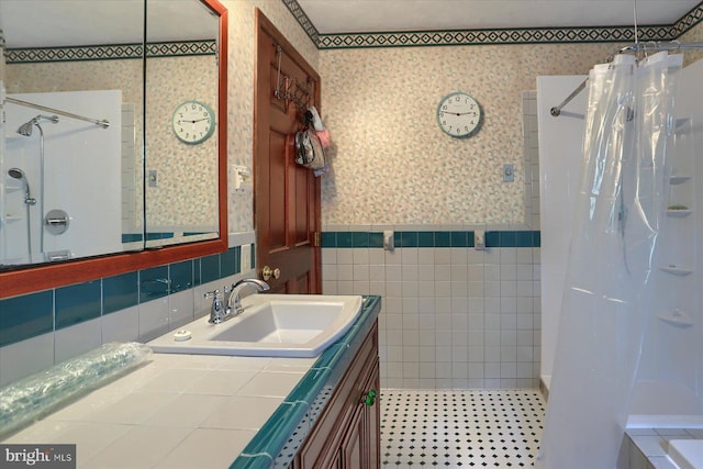 bathroom featuring tile walls, tile patterned floors, and vanity