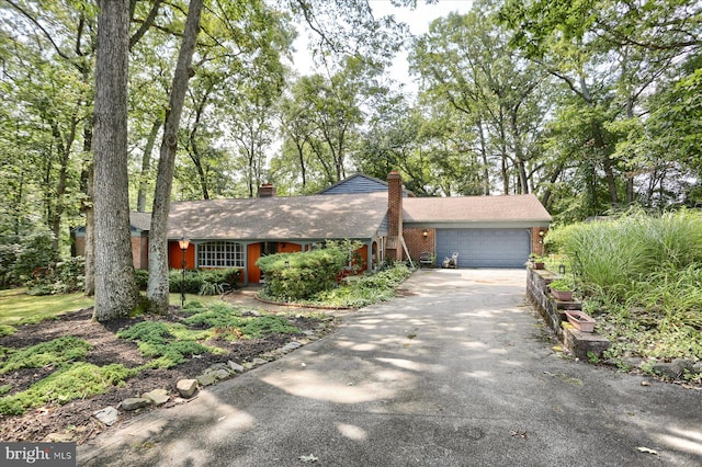 ranch-style home with a garage