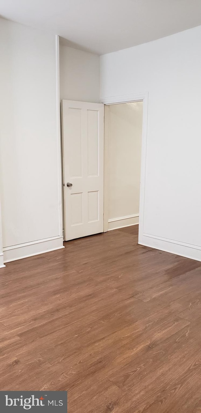 empty room featuring dark hardwood / wood-style floors