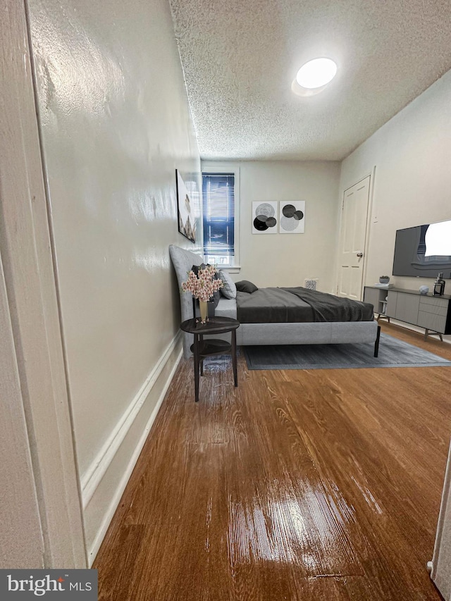 1830 E Cornwall St, Philadelphia, PA 19134 - bedroom with baseboards, wood finished floors, and a textured ceiling