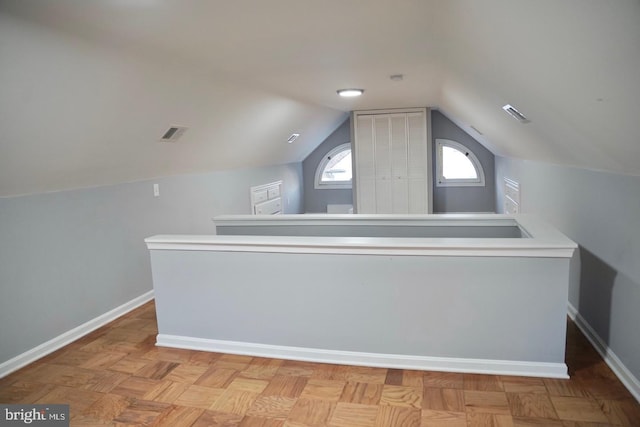 bonus room with vaulted ceiling