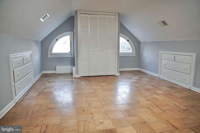 bonus room featuring vaulted ceiling