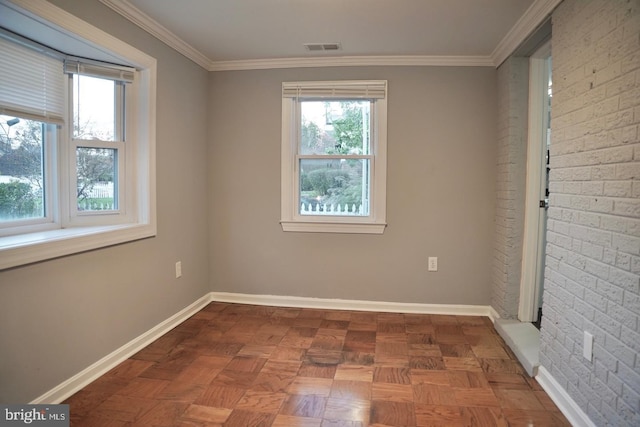 empty room with parquet flooring and crown molding