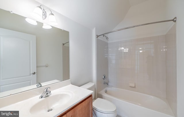 full bathroom featuring vanity, toilet, and tiled shower / bath combo