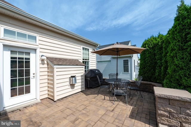 view of patio with a grill