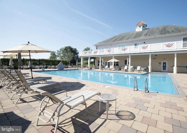 view of swimming pool with a patio area