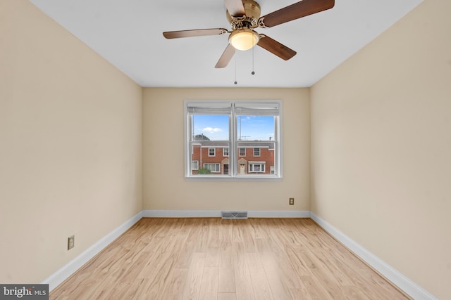 spare room with light hardwood / wood-style flooring and ceiling fan