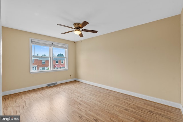 spare room with ceiling fan and light hardwood / wood-style flooring