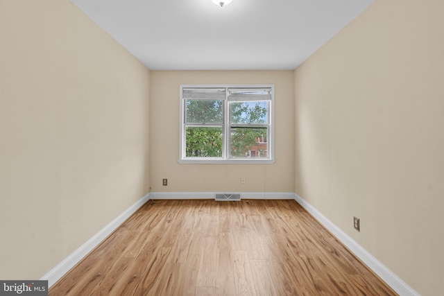 unfurnished room with light hardwood / wood-style flooring