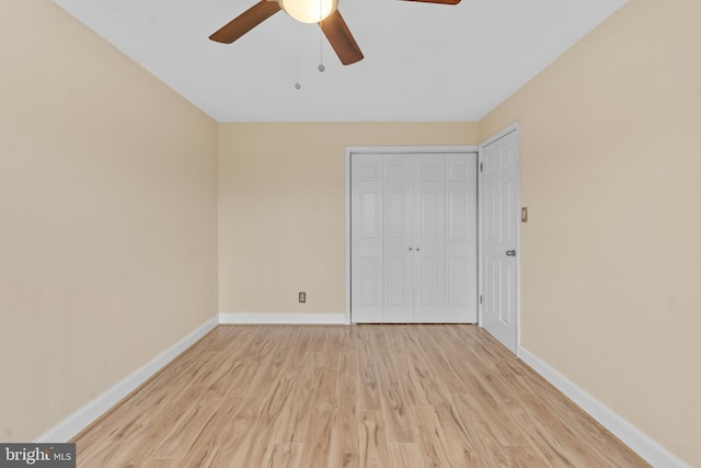 unfurnished bedroom with a closet, ceiling fan, and light wood-type flooring