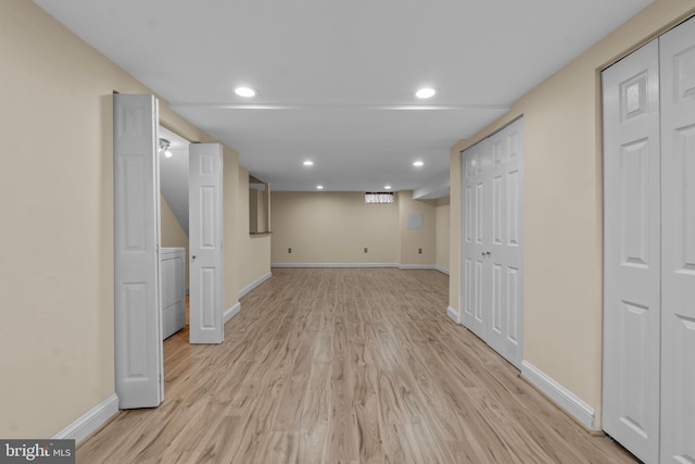 basement with light hardwood / wood-style floors