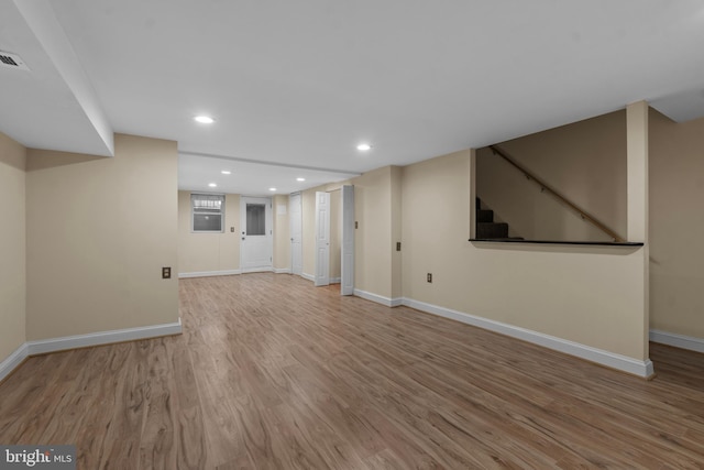 basement featuring light wood-type flooring