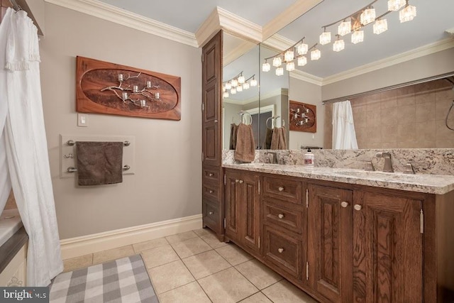 bathroom with tile patterned floors, crown molding, and double vanity