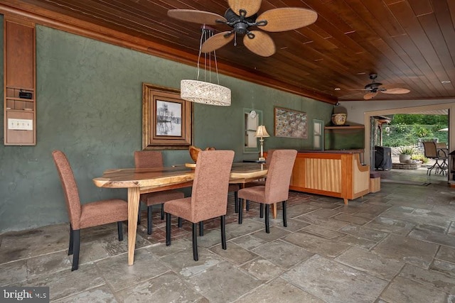 dining space featuring tile patterned floors, ceiling fan, and wood ceiling